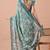 Women's teal floral print chiffon saree with unstitched blouse piece