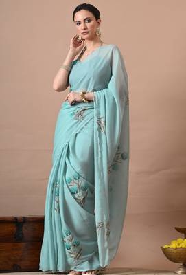 Women's turquoise floral print georgette saree with unstitched blouse piece 1