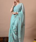 Women's turquoise floral print georgette saree with unstitched blouse piece