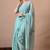 Women's turquoise floral print georgette saree with unstitched blouse piece