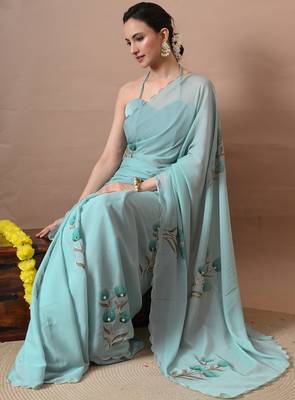 Women's turquoise floral print georgette saree with unstitched blouse piece 2