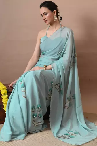 Women's turquoise floral print georgette saree with unstitched blouse piece