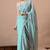 Women's turquoise floral print georgette saree with unstitched blouse piece