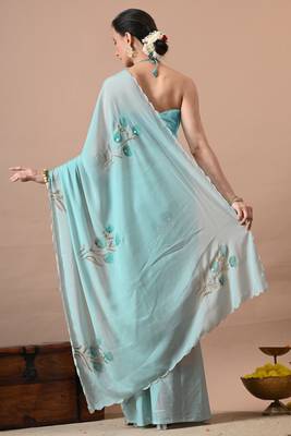 Women's turquoise floral print georgette saree with unstitched blouse piece 4