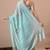 Women's turquoise floral print georgette saree with unstitched blouse piece