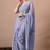 Women's lavender floral print georgette saree with unstitched blouse piece