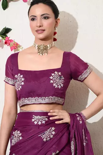 Women's magenta embellished georgette saree with unstitched blouse piece