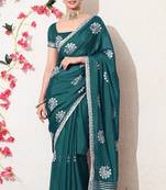 Women's green embellished georgette saree with unstitched blouse piece