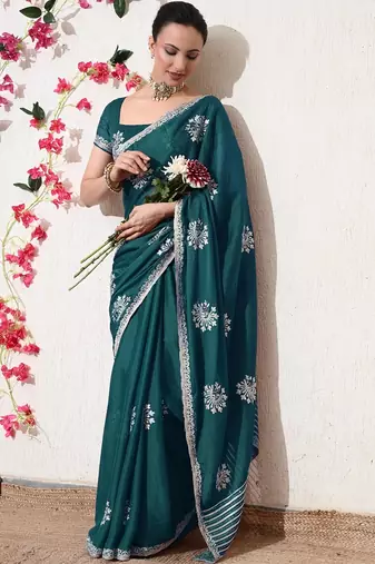 Women's green embellished georgette saree with unstitched blouse piece