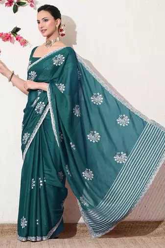 Women's green embellished georgette saree with unstitched blouse piece