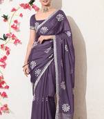 Women's purple embellished georgette saree with unstitched blouse piece