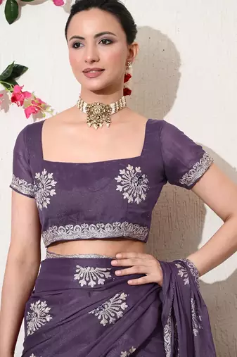 Women's purple embellished georgette saree with unstitched blouse piece