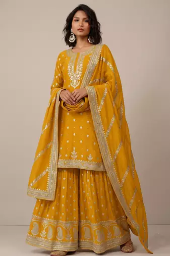 Yellow heavy silk blend  classic embroidered party wear salwar suit