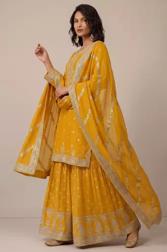 Yellow heavy silk blend  classic embroidered party wear salwar suit