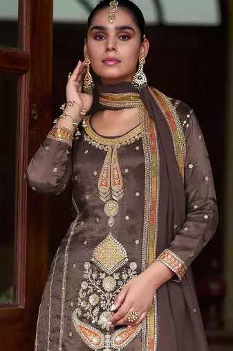 Coffee brown silk blend zari sequins  and embroidery work with floral motifs contrast border. semi stitched suit