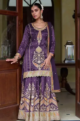 Deep purple silk blend zari sequins  and embroidery work with floral motifs contrast border. semi stitched suit