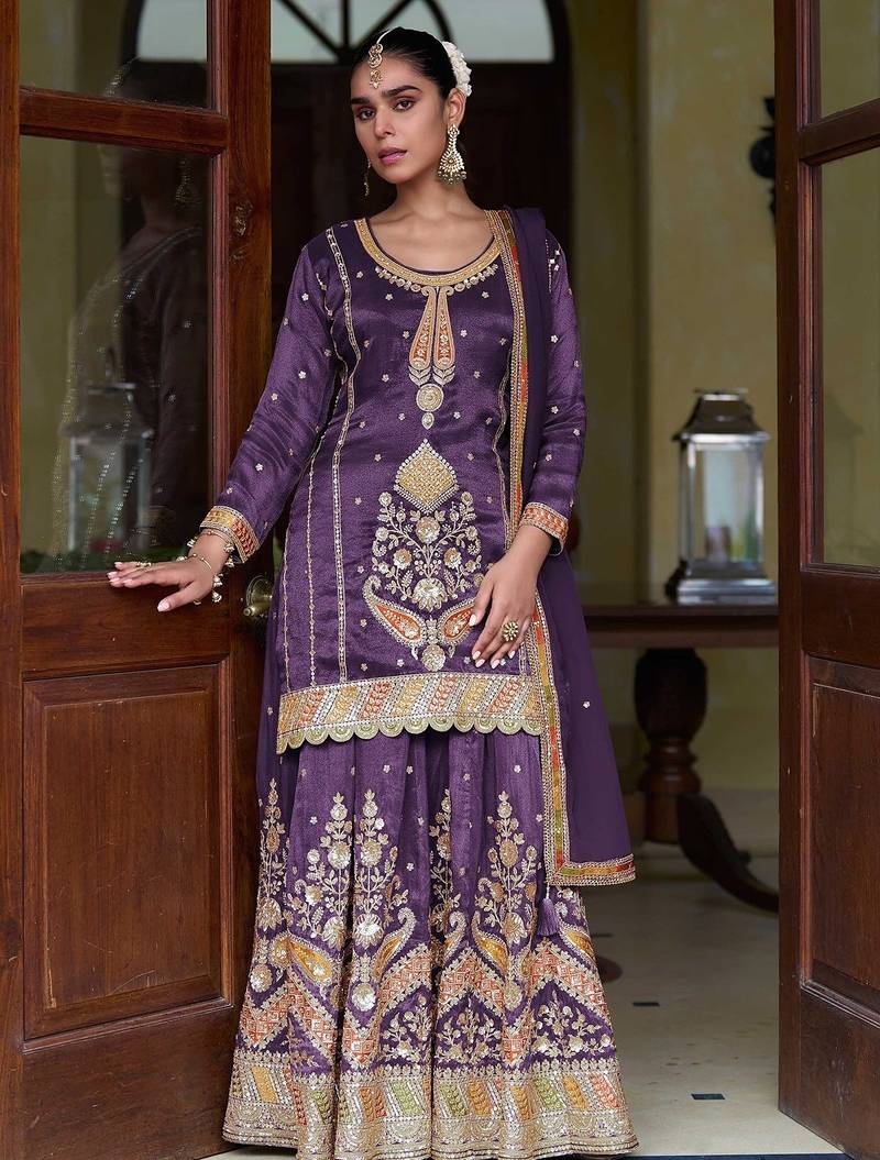 Deep purple silk blend zari sequins  and embroidery work with floral motifs contrast border. semi stitched suit