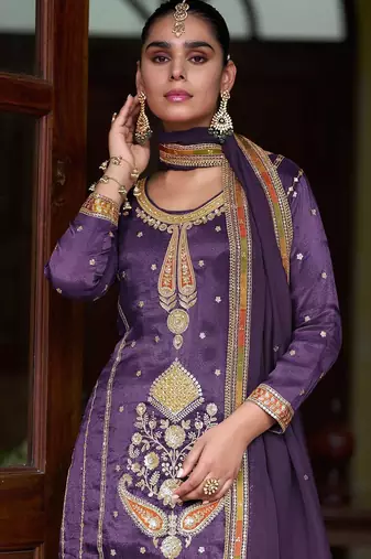 Deep purple silk blend zari sequins  and embroidery work with floral motifs contrast border. semi stitched suit