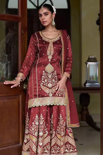 maroon silk blend zari sequined and embroidery work with floral motifs and detailed contrast border. semi stitched suit