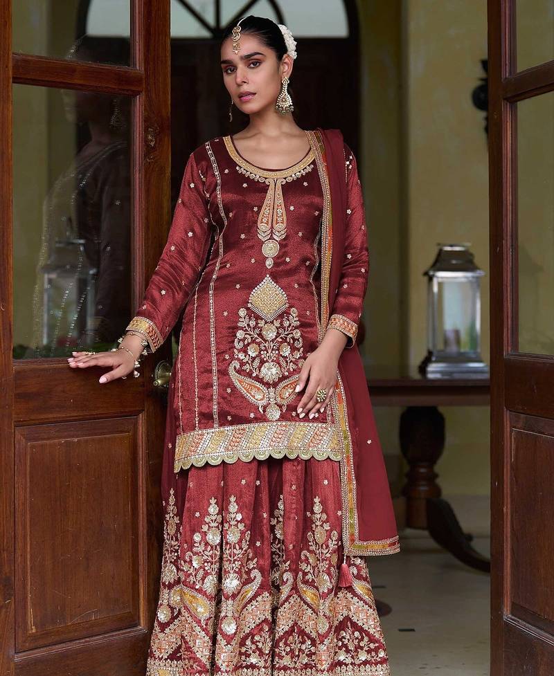 maroon silk blend zari sequined and embroidery work with floral motifs and detailed contrast border. semi stitched suit