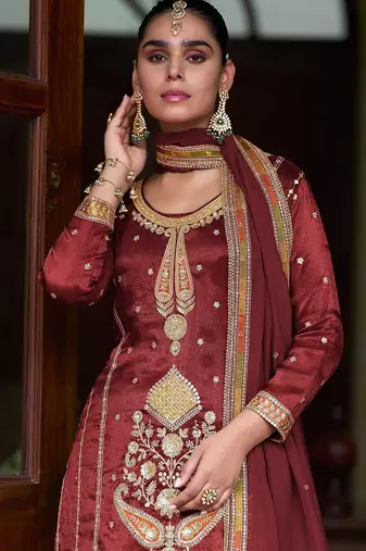 maroon silk blend zari sequined and embroidery work with floral motifs and detailed contrast border. semi stitched suit