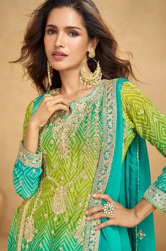 turquoise blue silk blend embroidery and handwork semi stitched suit