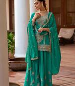  emerald green silk blend zari embroidery thread work motif work sequined and detailed border semi stitched suit