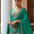  emerald green silk blend zari embroidery thread work motif work sequined and detailed border semi stitched suit