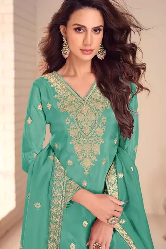 turquoise silk blend embroidered and sequined semi stitched suit