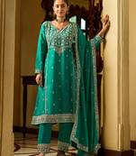 rama green silk blend gold silver zari embroidered  sequined & mirror semi stitched suit