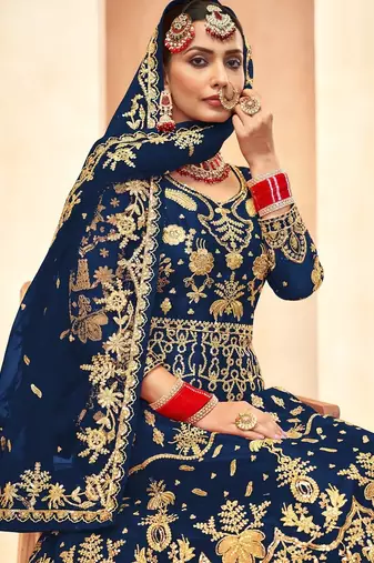 sapphire blue net embroidery work  sequined cording & stone work. semi stitched suit