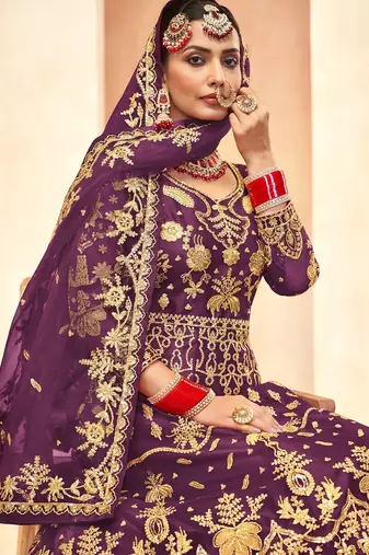 royal purple net embroidery work  sequined cording & stone work. semi stitched suit