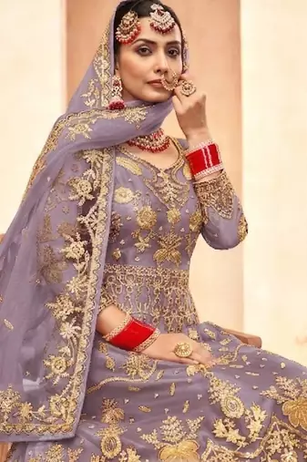 soft lavender net embroidery work  sequined cording & stone work. semi stitched suit