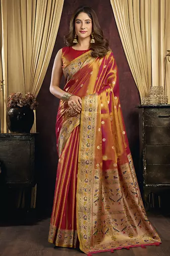 orange tissue with tassels traditional wear saree