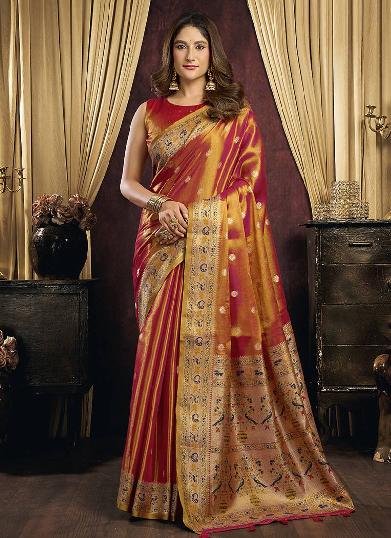 orange tissue with tassels traditional wear saree