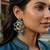 Dual plated peacock motif silver earrings