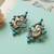 Dual plated peacock motif silver earrings