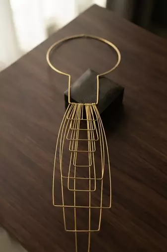 Gold metallic wire cage necklace