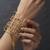 Gold fringe wire cage cuff bangle