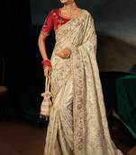 Cream kanjivaram zari, thread, zarkan, cut-dana with moti heavy hand work saree with blouse