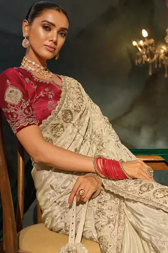Cream kanjivaram zari, thread, zarkan, cut-dana with moti heavy hand work saree with blouse