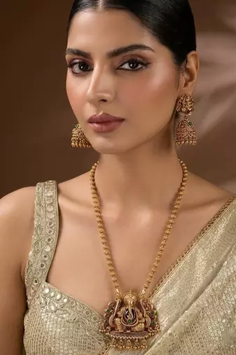 South indian long mala ganesh jii green necklace set with earrings for women.