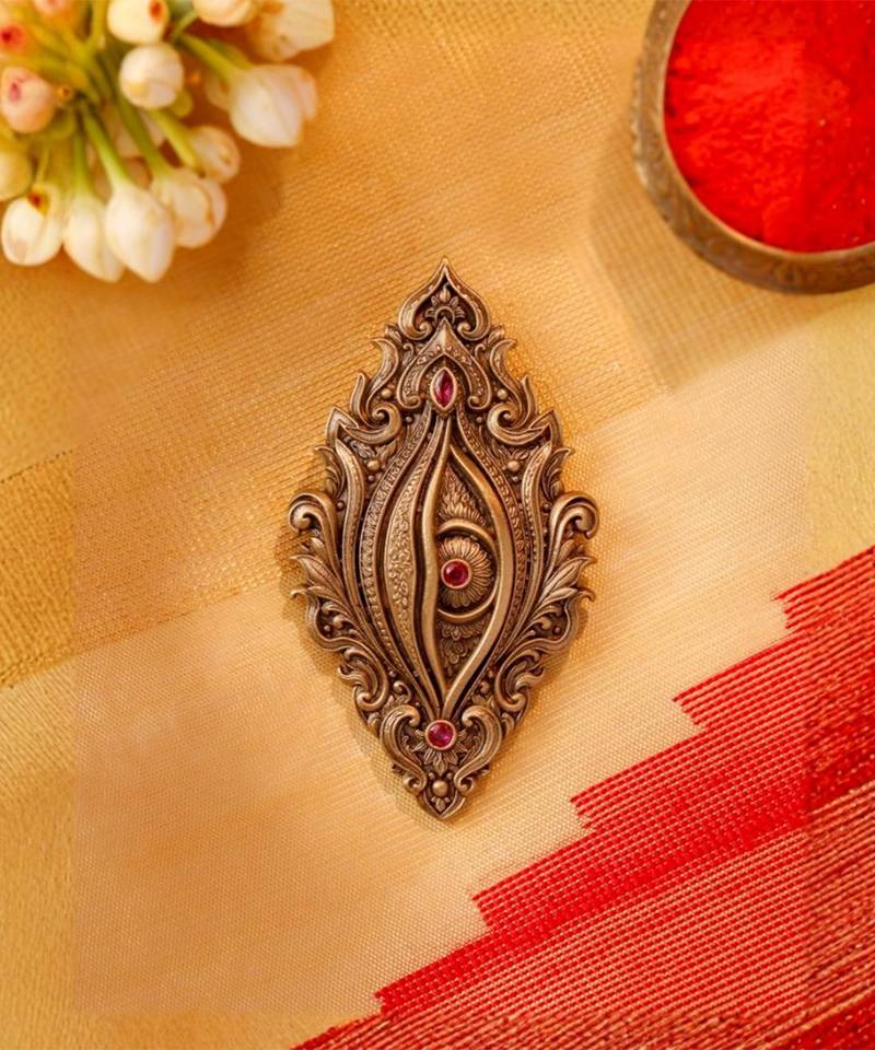 Antique gold brass divine eye brooch