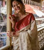 Off white red silk blend jacuard work festival saree with unstitched blouse piece