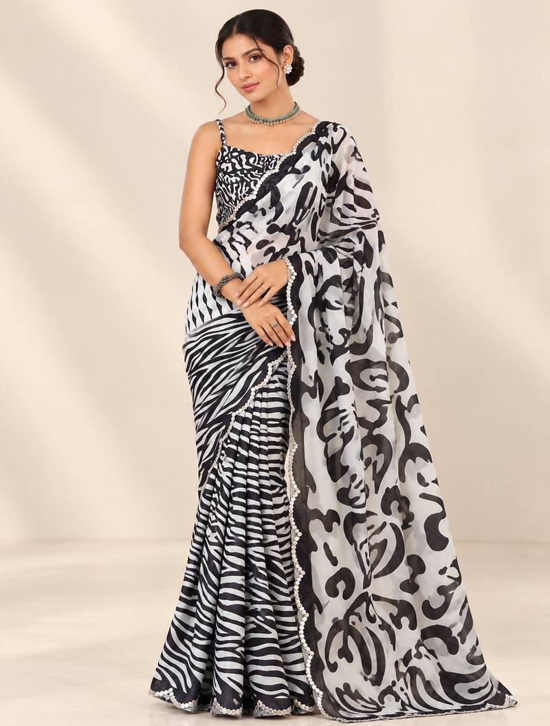 black heavy silk blend printed saree with pape mirror work & mirror border