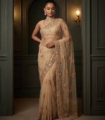 Beige embroidered net saree
