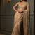 Beige embroidered net saree
