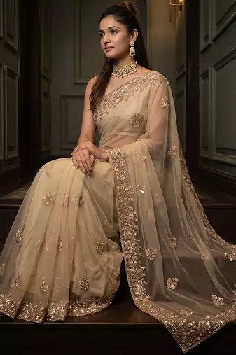 Beige embroidered net saree
