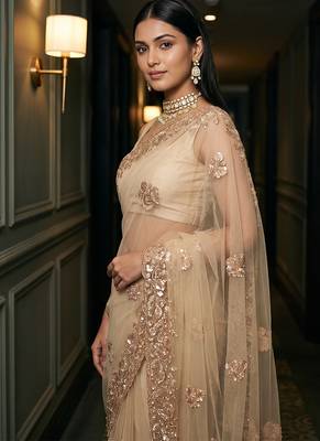 Beige embroidered net saree 4