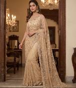 Beige embroidered net saree